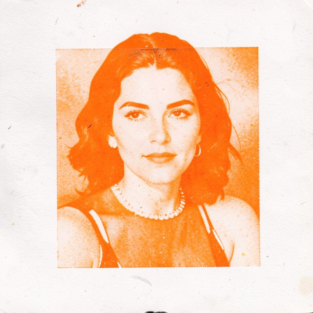 A small two-ink risograph print in warm terracotta and charcoal, showing a timeless female figure rendered with soft, flowing lines.